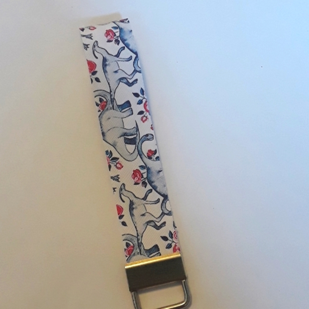 Dinosaur and rose faux leather wristlet keychain